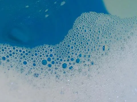 Semi-abstract picture of the pattern of white bubbles against a blue background Stock Photos