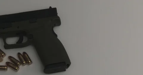 Semi Automatic 9Mm Gun Pistol And Bullets - Pan Stock Footage 85653438