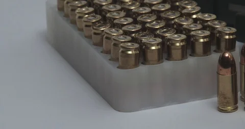 Semi Automatic 9Mm Gun Pistol And Bullets - Panning Stock Footage 85653554