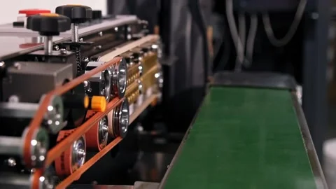 Semi automatic package sealing conveyor Stock Footage 202259912