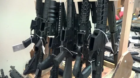 Semi automatic Rifles on Display at a Gun Show Stock Footage 122953870