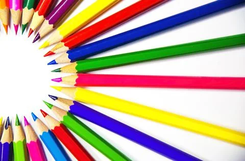 Semi-circle of crayons on a white background Stock Photos