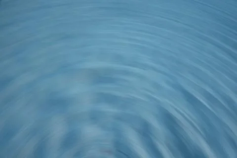 Semi-circle sand pattern with pale blue hue Stock Photos