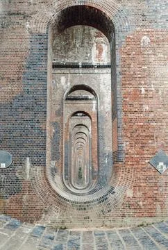 The semi-circular arches vaulting supporting brick piers, composed of tradi.. Stock Photos