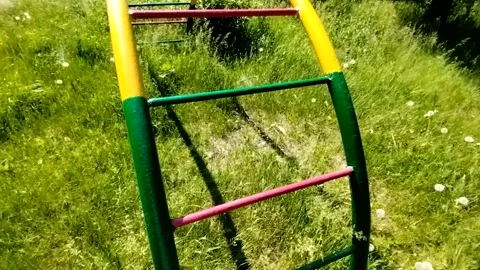 Semi-circular colored metal staircase on a playground Stock Footage 311061732