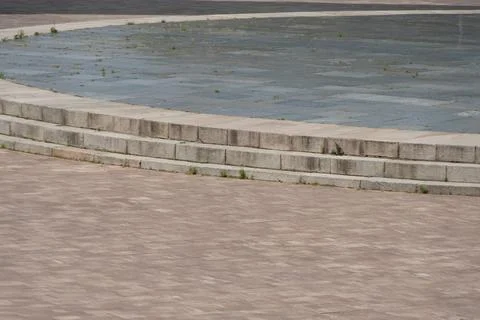 Semi-circular stone step seating area, green mossalgae on stones, circular .. Stock Photos