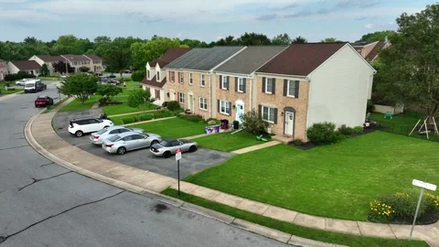 Semi detached houses with front yard in suburbia of American town. Parking cars Stockbeeldmateriaal 313872703