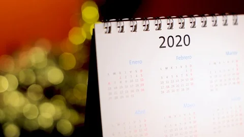 Semi-lateral view of a white calendar of the new year 2020 with bokeh effect Stock Footage 120465250