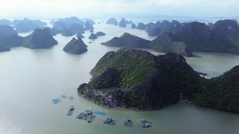 Semi orbit of floating structures and island in Ha Long Bay, Vietnam Stock Footage 313610879