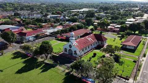 Semi-Orbit Panoramic Shot of San Lorenzo's Church and Gardens, Costa Rica Stock Footage 317847734