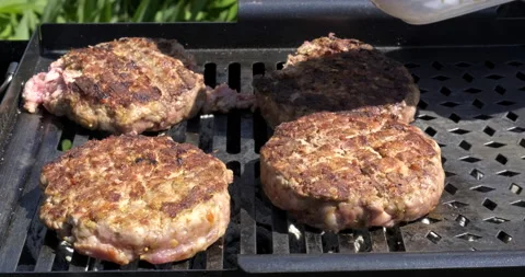 Semi-prepared Meat Cutlets. Chef Spreads Red Tomato Sauce. Cooking Meat on Grill Stock Footage 132473922