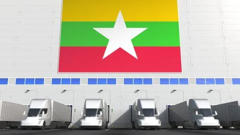 Semi-trailer trucks at warehouse loading dock with flag of Myanmar. Myanma Stock Illustration