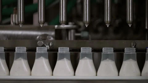 Semi-transparent plastic bottles moving through the production line. Stock Footage 250482705