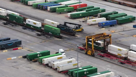 Semi Truck and Crane Operating in Intermodal Transfer Area Stock Footage 337716976