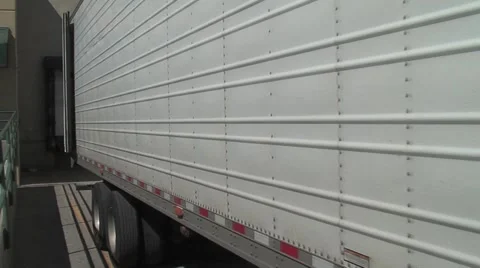 Semi truck backing into loading dock Video stock 6219154
