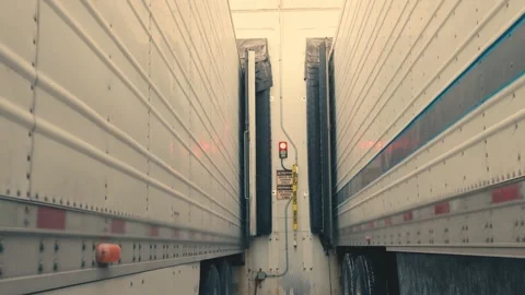 Semi truck backing into loading dock for unloading cargo Stock-Footage 346007671