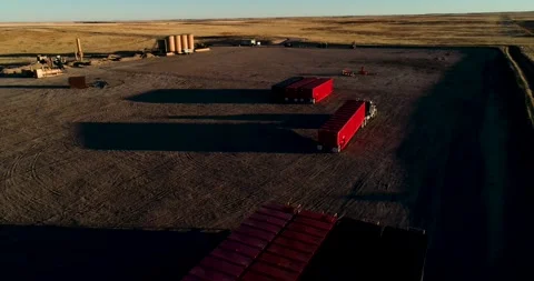 A semi truck driver skillfully delivers a piece of fracking equipment to a Stock Footage 167622953