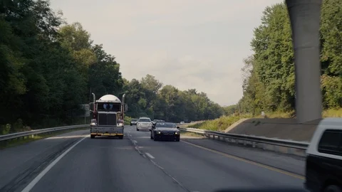 Semi Truck Drives down interstate highway in North Carolina Stock Footage 94738757