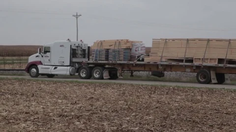 Semi Truck Driving Through Empty Cornfield 2 Stock Footage 79034591