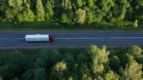 A semi-truck with a trailer and a truck carry household items. The concept of Stock Footage