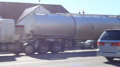 Semi trucks go through a small town Stock Footage 30150370