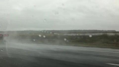 Semi trucks on interstate in rain Stock Footage 122326339