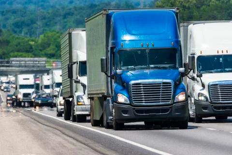 Semi Trucks Pack Crowded Interstate Highway Stock Photos