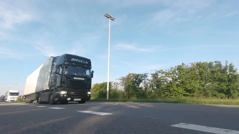 Semi trucks van cargo and parcel delivery driving on a highway Stock Footage 132667571