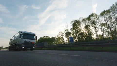 Semi trucks van cargo and parcel delivery driving on a highway Stock Footage 132668024