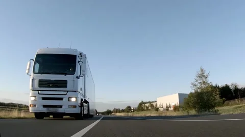 Semi trucks van cargo and parcel delivery driving on a highway. White Van delive Stock Footage 227622928