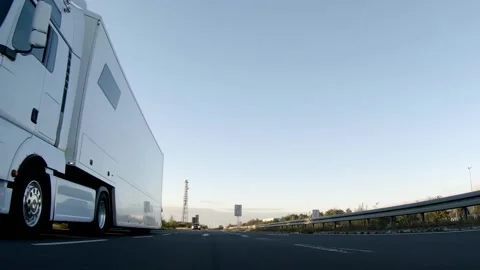 Semi trucks van cargo and parcel delivery driving on a highway. White Van delive Stock Footage 228680327