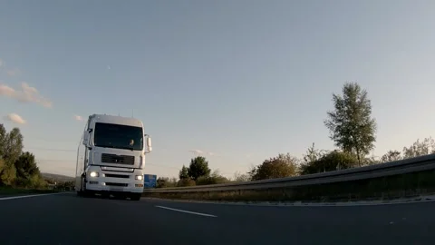 Semi trucks van cargo and parcel delivery driving on a highway. White Van delive Stock Footage 228680331