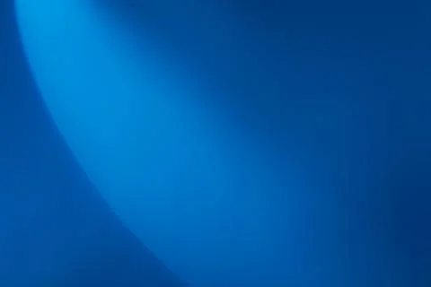 A semicircle of lights hits a blue background Stock Photos