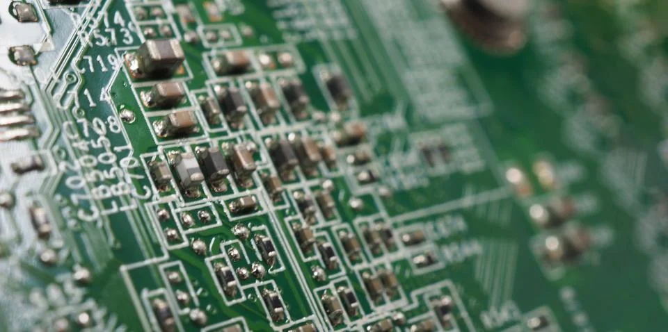 Semiconductor. cpu chip located on the green motherboard of the computer. Stock Photos