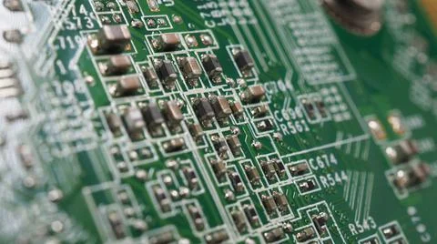 Semiconductor. cpu chip located on the green motherboard of the computer. Stock Photos