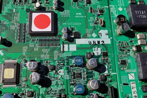 Semiconductor printed circuit board. Concept: Hinomaru semiconductor. Stock Photos
