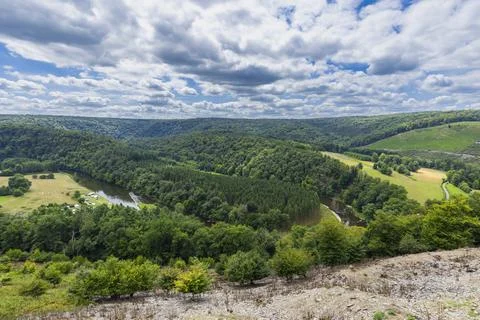 Semois river winding through forested valley in Herbeumont Stock Photos
