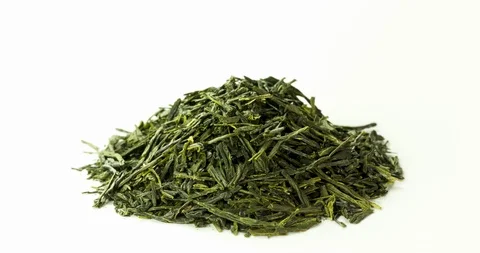 Sencha green tea rotating leaves isolated on white 스톡 동영상 94025452