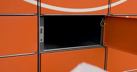 Send parcel with self service post terminal machine. hand open locker and put Stock Footage 146126270