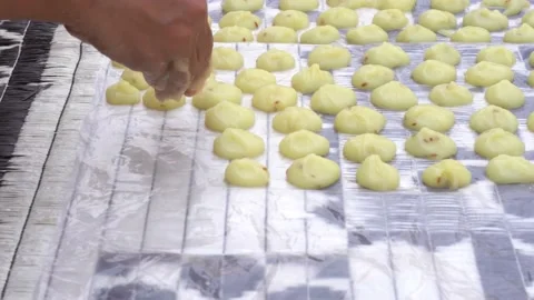 Sendige dough laid on sheets for drying in the sun, side view 動画素材 163371483