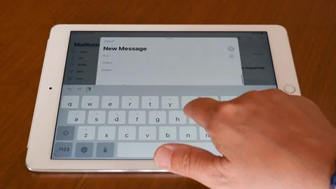 Sending a business e-mail with Apple Ipad Stock Footage 114328081