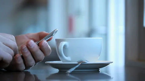 Sending email or text at a coffee shop Stockbeeldmateriaal 24529055