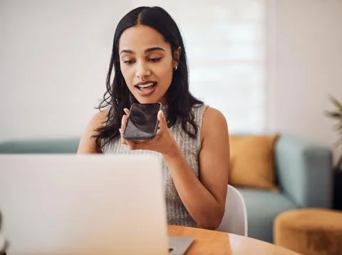Sending voice notes is another quick method of communication. a young Stock Photos
