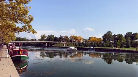 Seneca Falls, NY, USA-Small Fishing Boat Cruises Down Canal, CIRCA Sept. 2017 Stock Footage 83793587