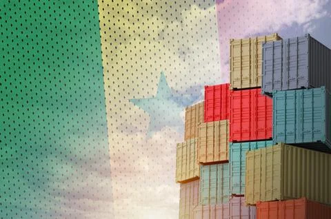 Senegal flag and big stack of shipping cargo containers in docks with sky Stock Photos