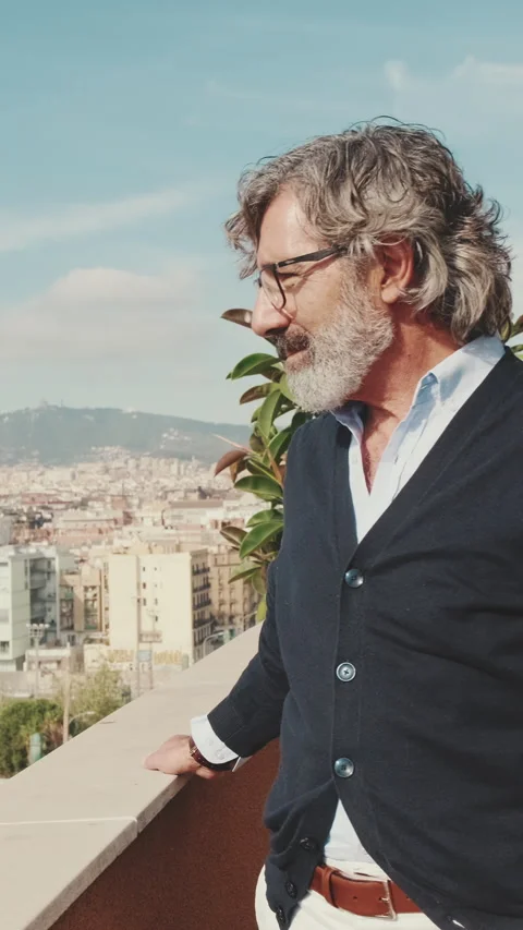 Senier enjoys the view standing on the balcony Stock Footage 229508186