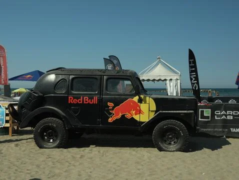 SENIGALLIA, ITALY - JULY 22, 2022: Red Bull Jeep on beach. Car presentation Stock Photos