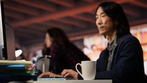 Senior admin working in innovative startup office, close up Stock Photos