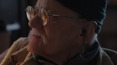 Senior adult working with computer by the desktop sitting in wheelchair Stock Footage 340550634