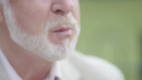 Senior affluent man talking and chewing his food at breakfast  Video stock 91508214